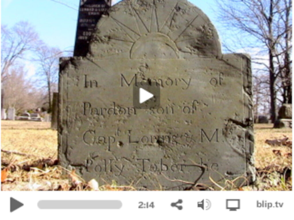 Screen grab from the video showing a gravestone.