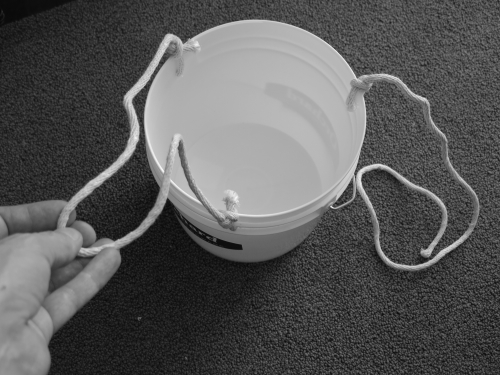 How the cords are tied to the buckets