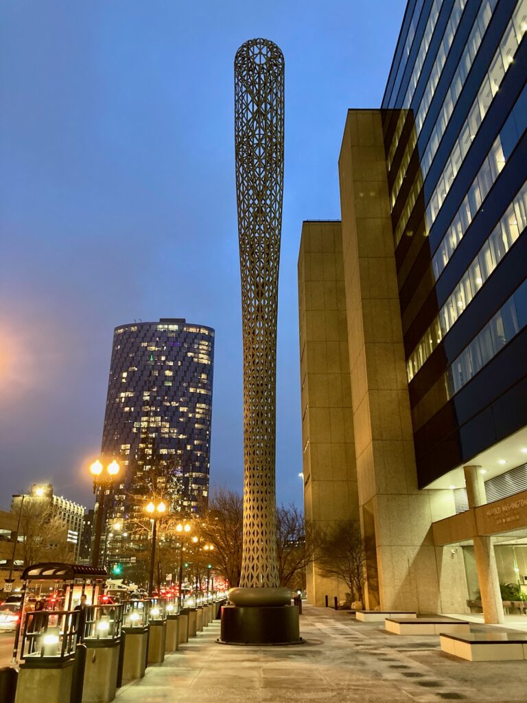 A large sculpture, about 100 feet tall, that looks like a huge baseball bat.