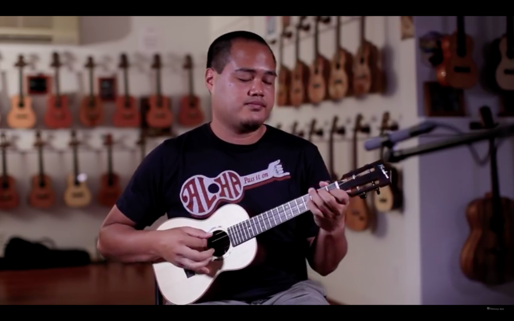 Screen grab showing Corey Fujimoto playing ukulele.