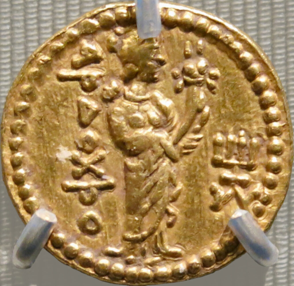 Gold coin with a crude image of a goddess.
