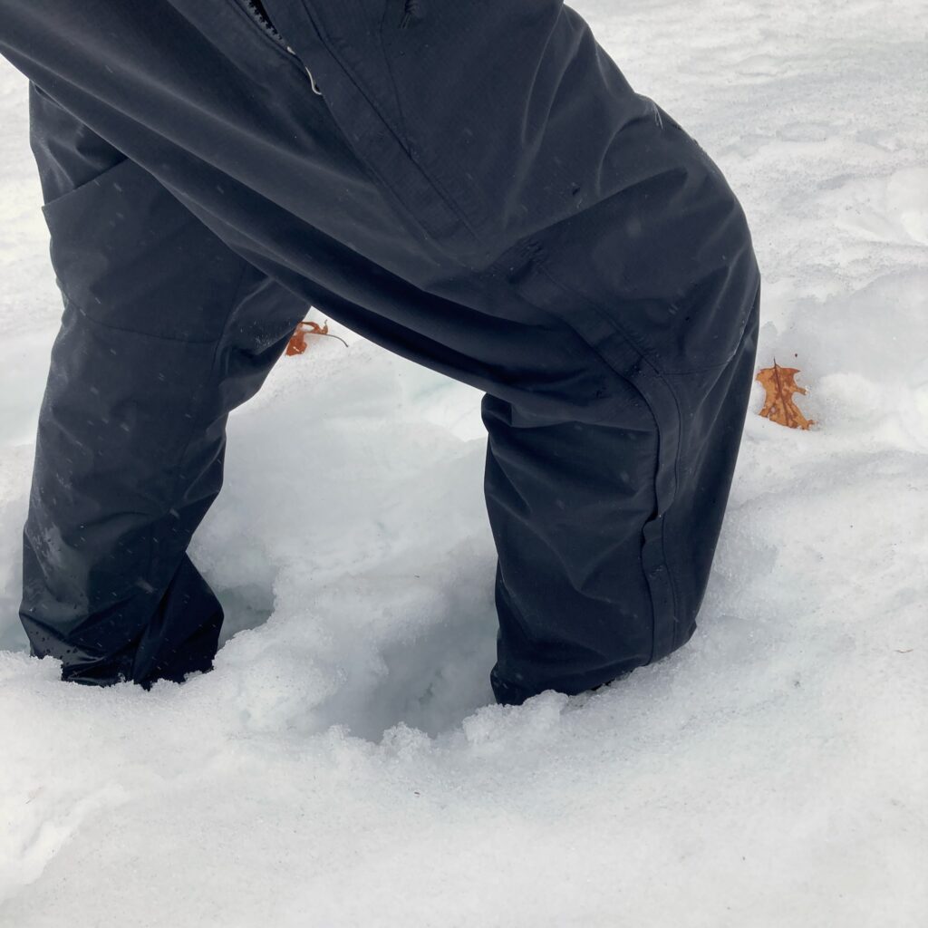 My legs in the snow, with the snow halfway up to my knees.